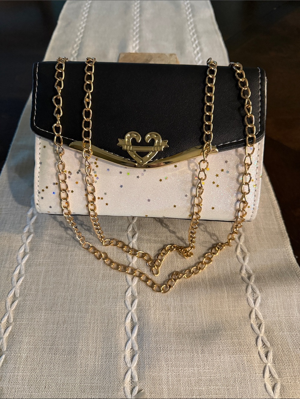Black and White Star Accent Crossbody Bag with Gold Chain